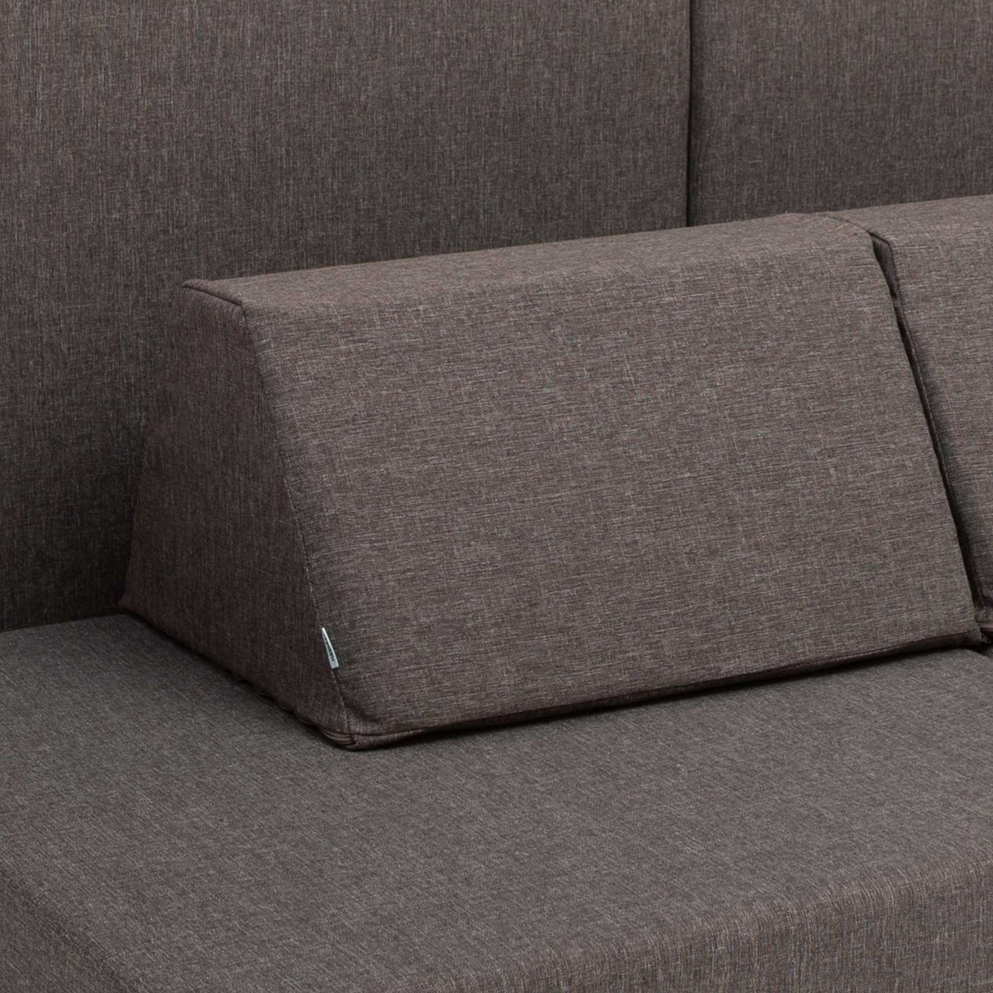 A closeup of a dark brown Monboxy trapezoidal shape