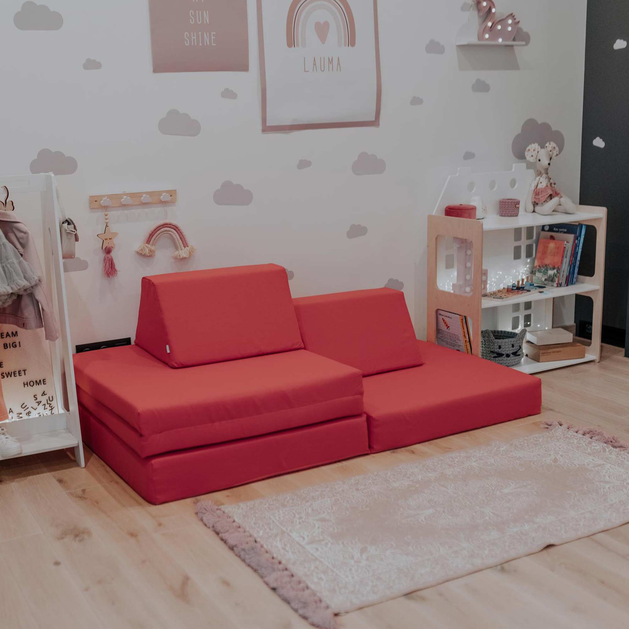 A coral Monboxy set in a toddler girl's bedroom
