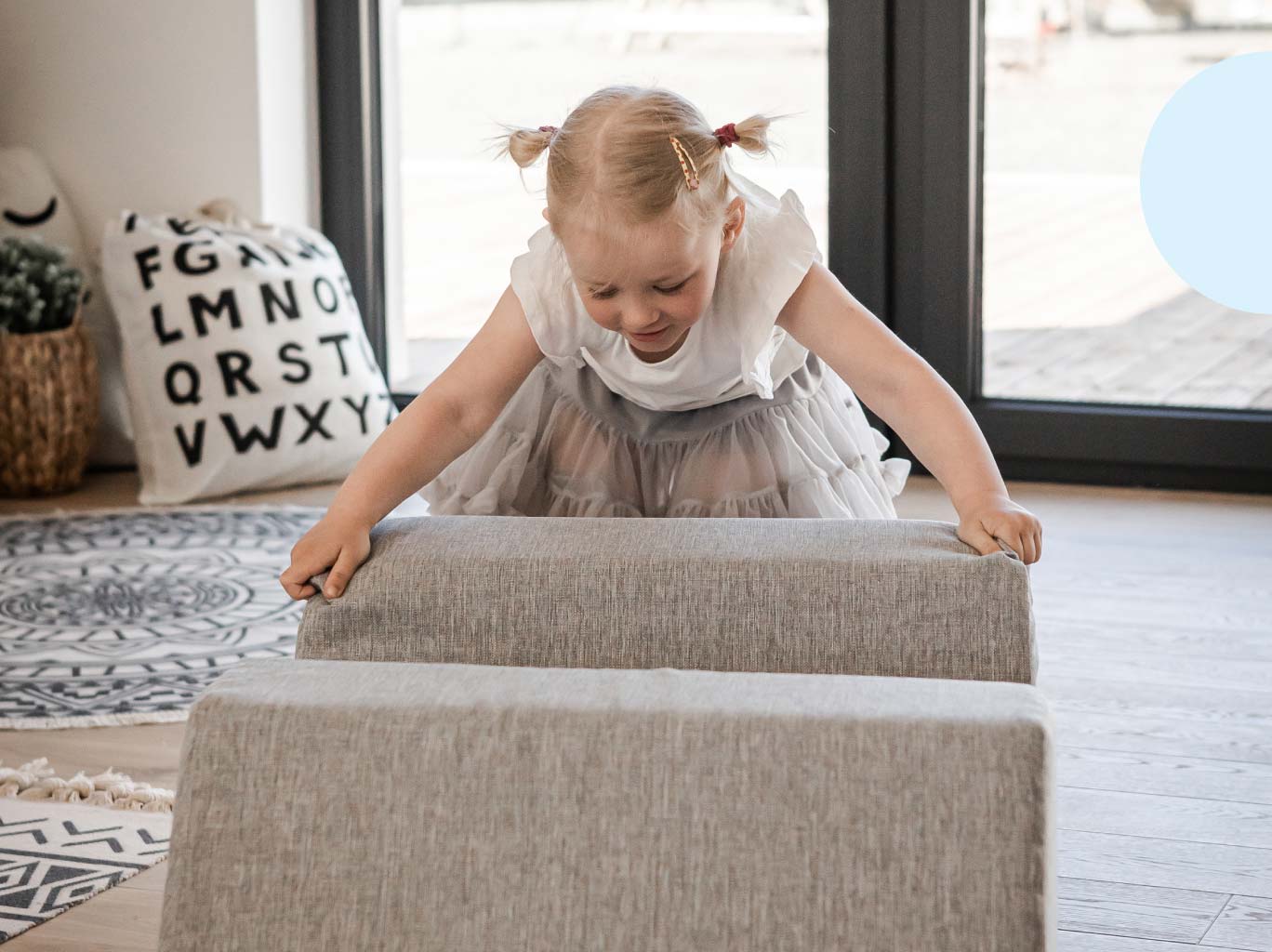 Toddler girl playing with with Monboxy play couch blocks