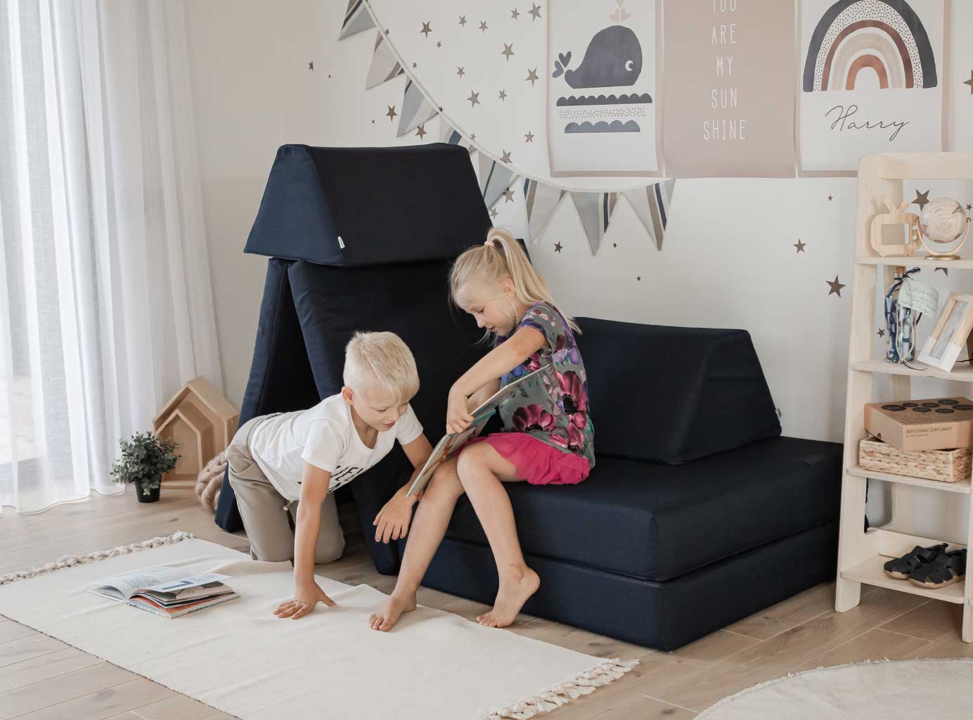 Brother and sister learning on navy kids play sofa set