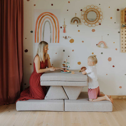 Mom and daughter playing tea time on a beige Monboxy play sofa 