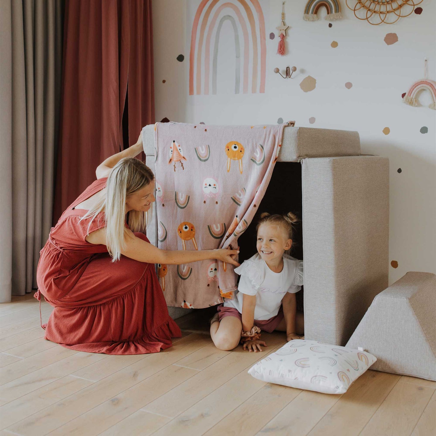 Mommy and daughter playing hide and seek inside a beige Monboxy play sofa set for kids