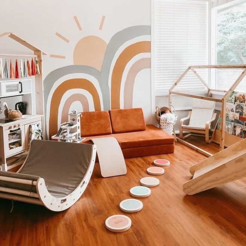 Kid's bedroom decorated in warm tones with many toys and Monboxy play sofa