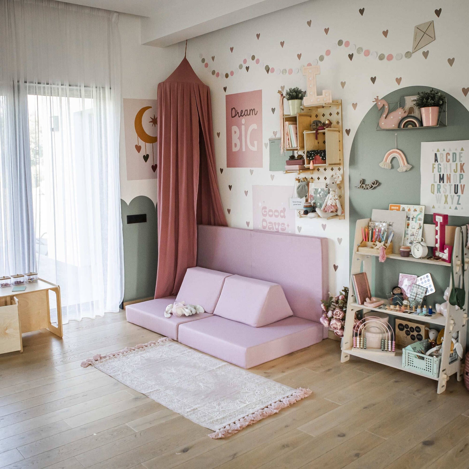 A pink Monboxy foam kid activity play set in a girl's bedroom