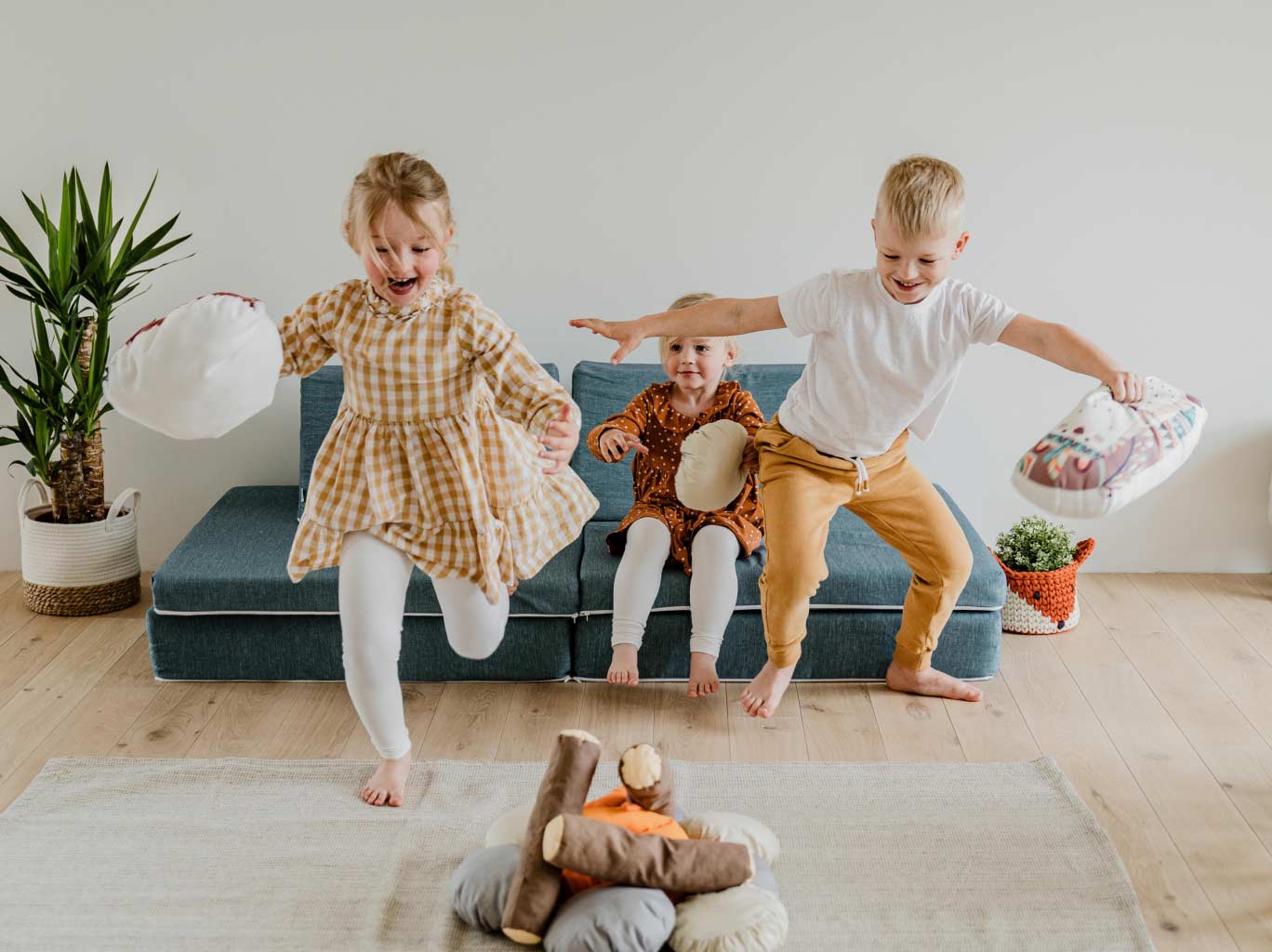 Three kids playing with their Monboxy activity play set