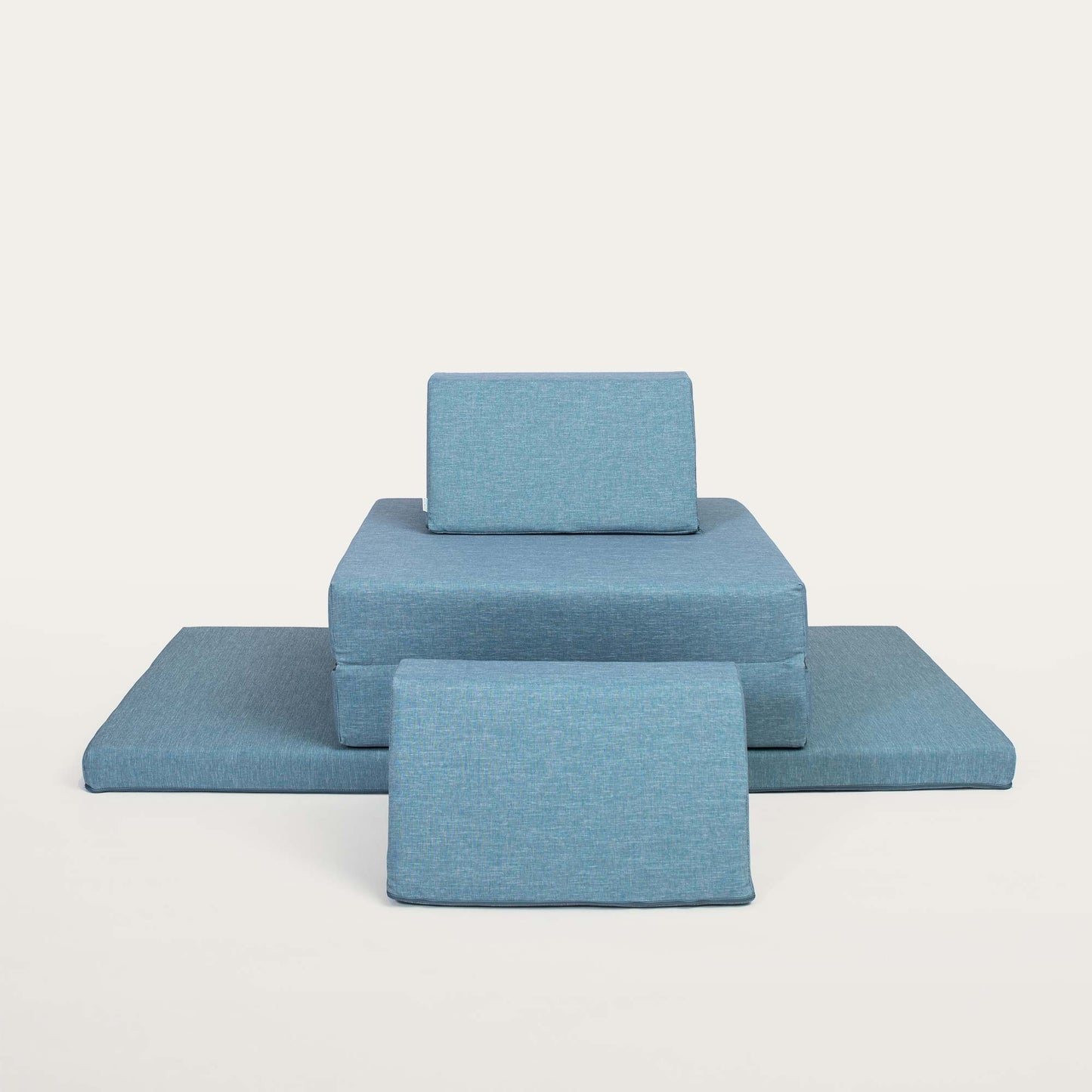 A turquoise Monboxy soft foam sofa set arranged into a medal pedestal form shape.