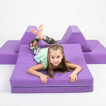 A girl playing with her Purple Monboxy play sofa set