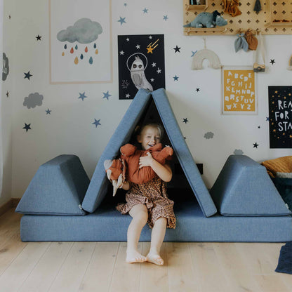 A turquoise Monboxy play couch set in the shape of a wigwam